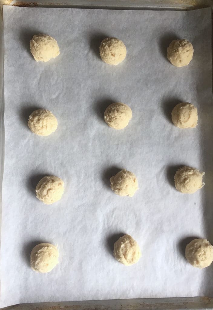 Gluten-free soft sugar cookie dough on a baking sheet.