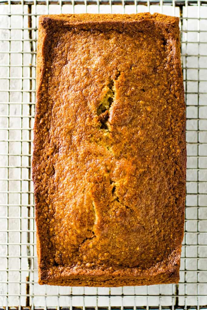 Gluten-free banana bread on a cooling rack.