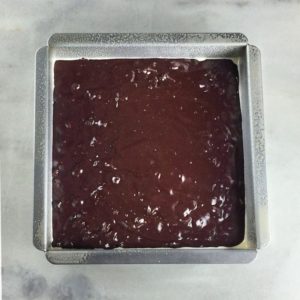 Krusteaz gluten free double chocolate brownie mix batter in a pan.