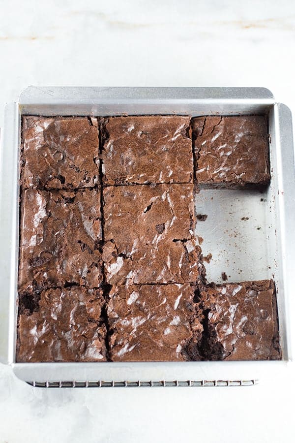 Krusteaz gluten free double chocolate brownie mix baked and cut in a pan.