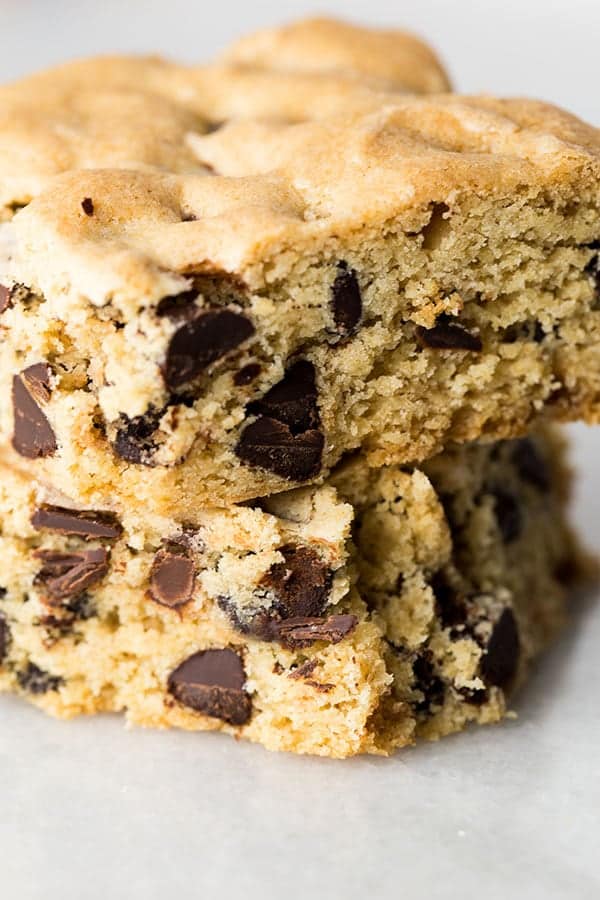 Two gluten-Free chocolate chip cookie bars in a stack.