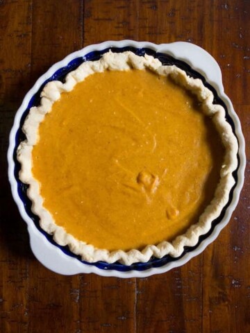 Egg-free, dairy-free, gluten-free pumpkin pie in pan.
