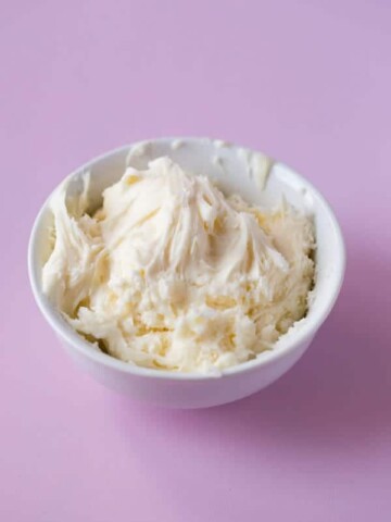 Gluten-Free Vanilla Buttercream Frosting in a white bowl.