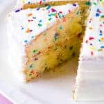 Gluten-free funfetti cake on white platter.