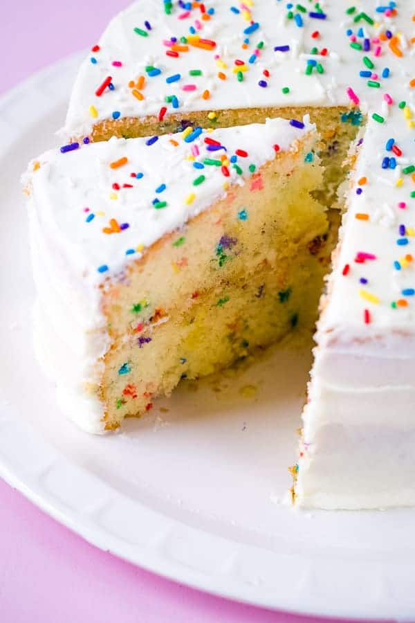Gluten-free funetti cake on white platter.