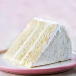 Gluten-free white cake slice on plate.