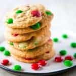 Gluten-free M&Ms cookies with red and green M&Ms on a plate.