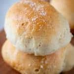 Two baked gluten-free soft dinner rolls.