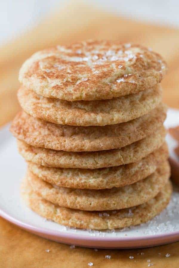Stack of baked snickerdoodles on a plate.