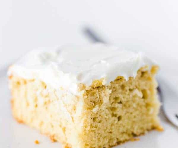 Slice of Gluten-Free Vanilla Sheet Cake on a plate.