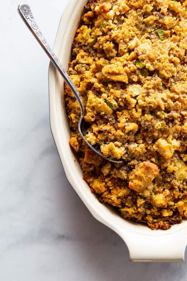 Baked gluten-free cornbread stuffing in a casserole dish.