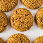 Baked gluten-free molasses cookies on a sheet pan.
