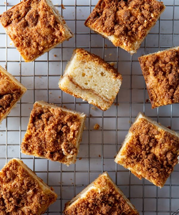 Squares of baked gluten-free coffee cake on a wire rack