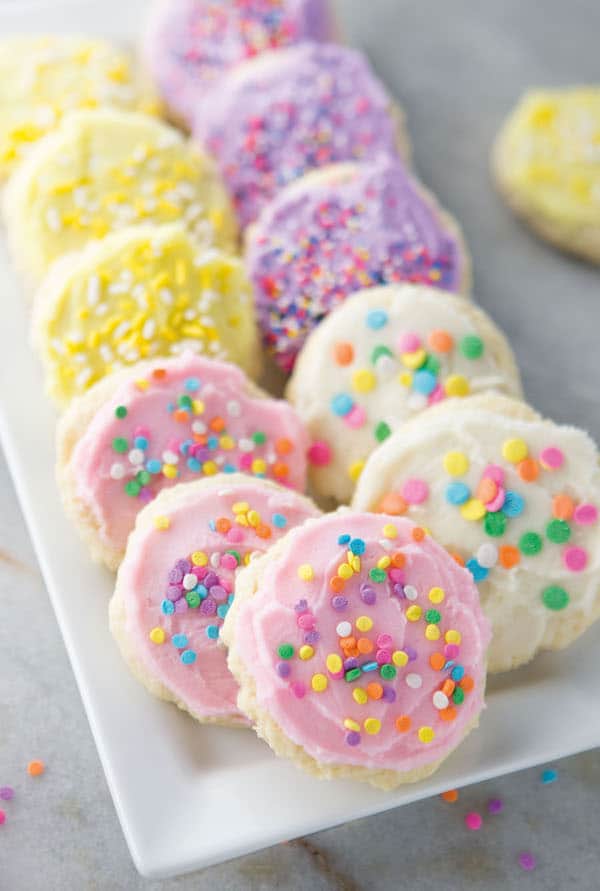 Gluten-free soft sugar cookies on a white platter.