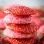 Baked gluten-free sugar cookies rolled in red and pink sugar.