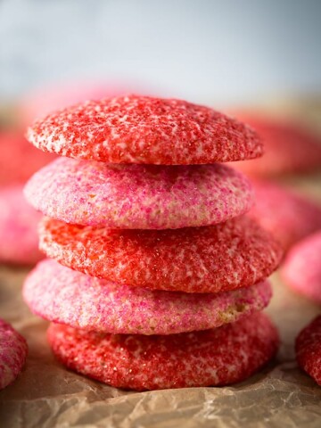 Baked gluten-free sugar cookies rolled in red and pink sugar.