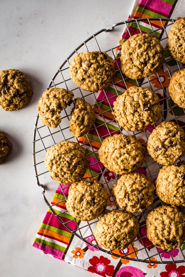 Baked gluten-free oatmeal cookies on a cooling rack.