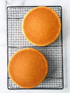 Gluten-free yellow cake, cooling on a wire rack.