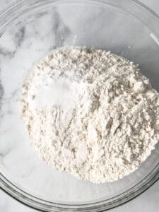 Gluten-free flour in a bowl with baking powder and salt.