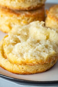 Split gluten-free biscuit on a plate.