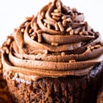 Gluten-free chocolate cupcake with chocolate frosting. Unwrapped from cupcake liner.