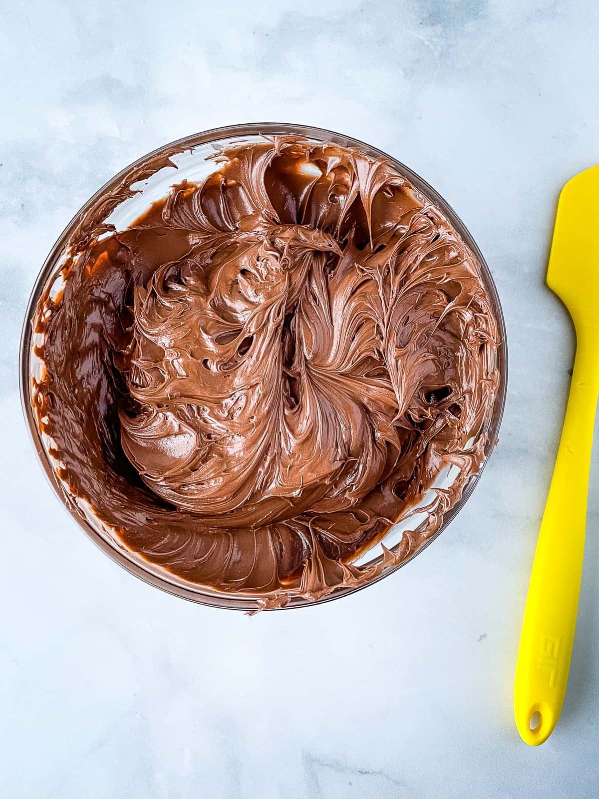 Bowl of gluten-free chocolate frosting.