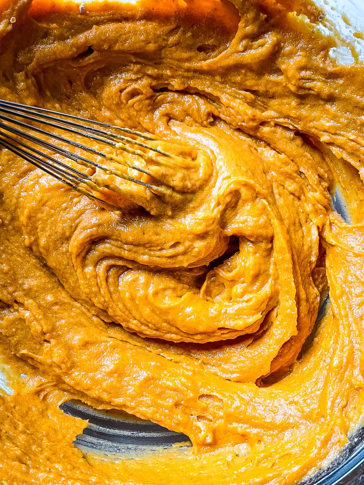 Gluten-free pumpkin batter mixed in a bowl.