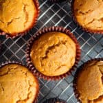 Gluten-free pumpkin muffins on a cooling rack.