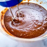 Gluten-free chocolate cake batter in a mixing bowl.