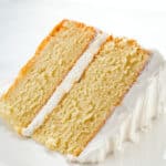 Slice of gluten-free vanilla cake on a plate.