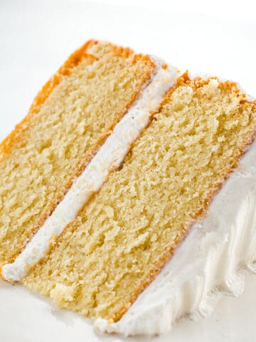 Slice of gluten-free vanilla cake on a plate.