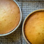Gluten-free vanilla cake cooling in pans.