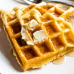 Two gluten-free waffles on a plate.