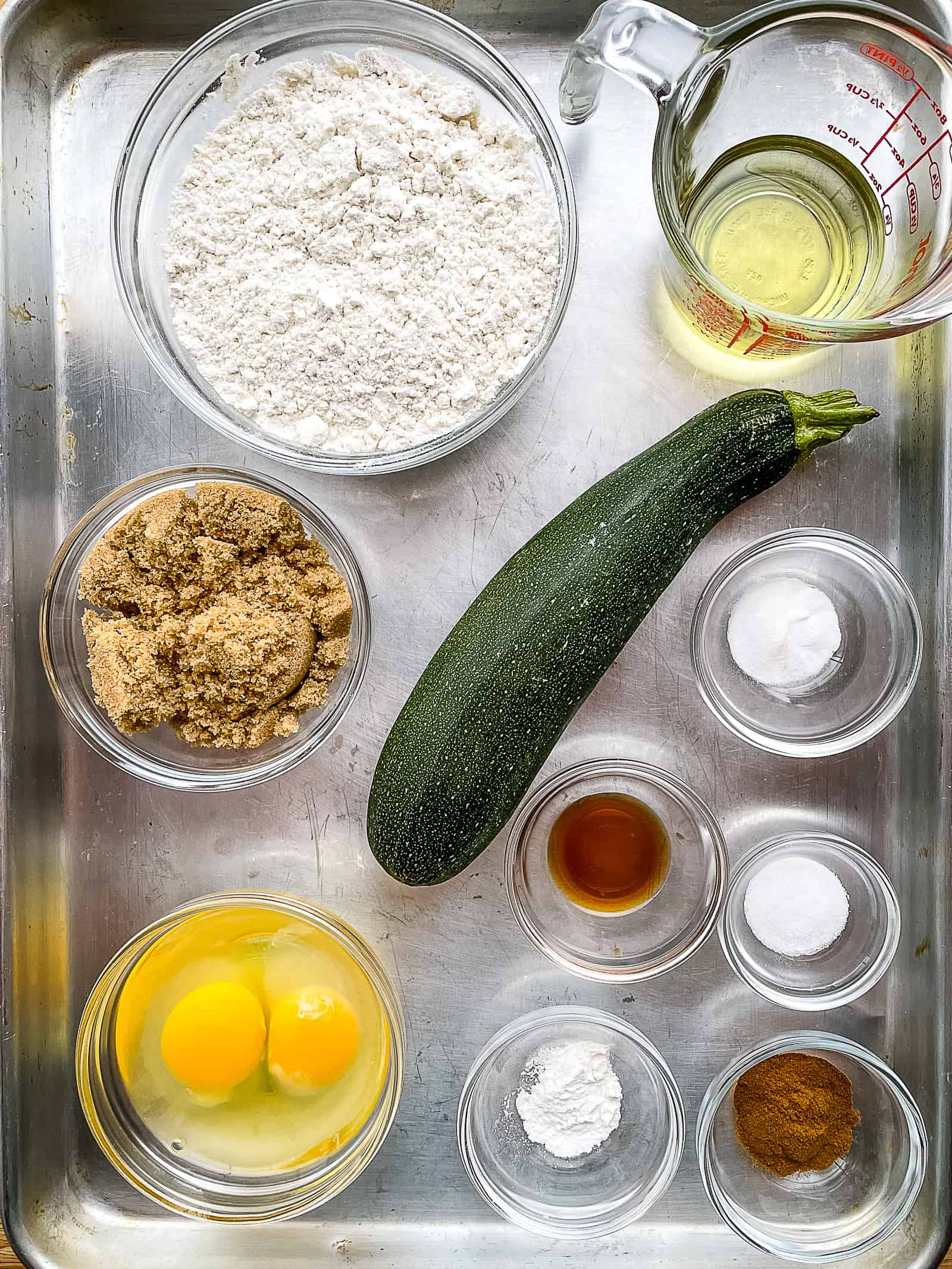 Ingredients for gluten-free zucchini bread in individual bowls.