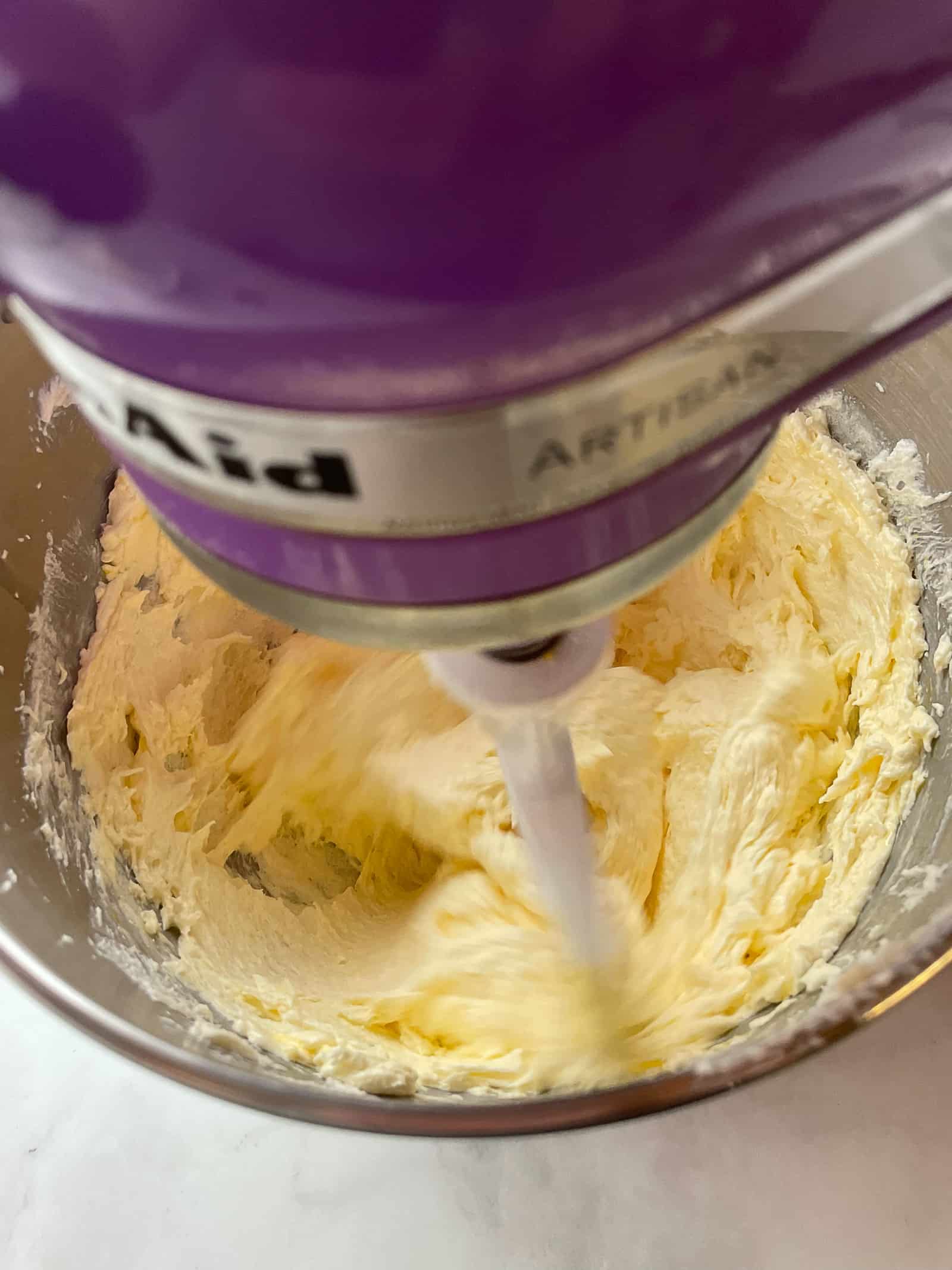 Butter, sugar, egg mixture in mixing bowl.