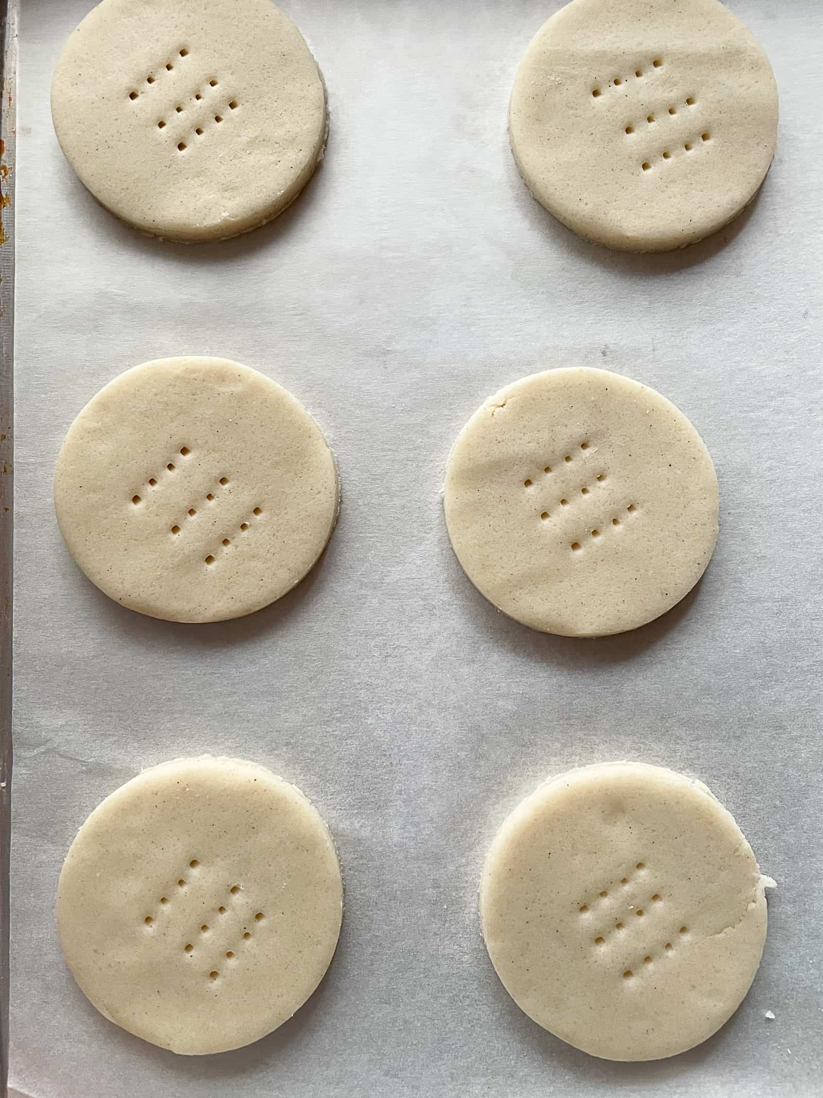 Gluten-free shortbread cookies cut into rounds.