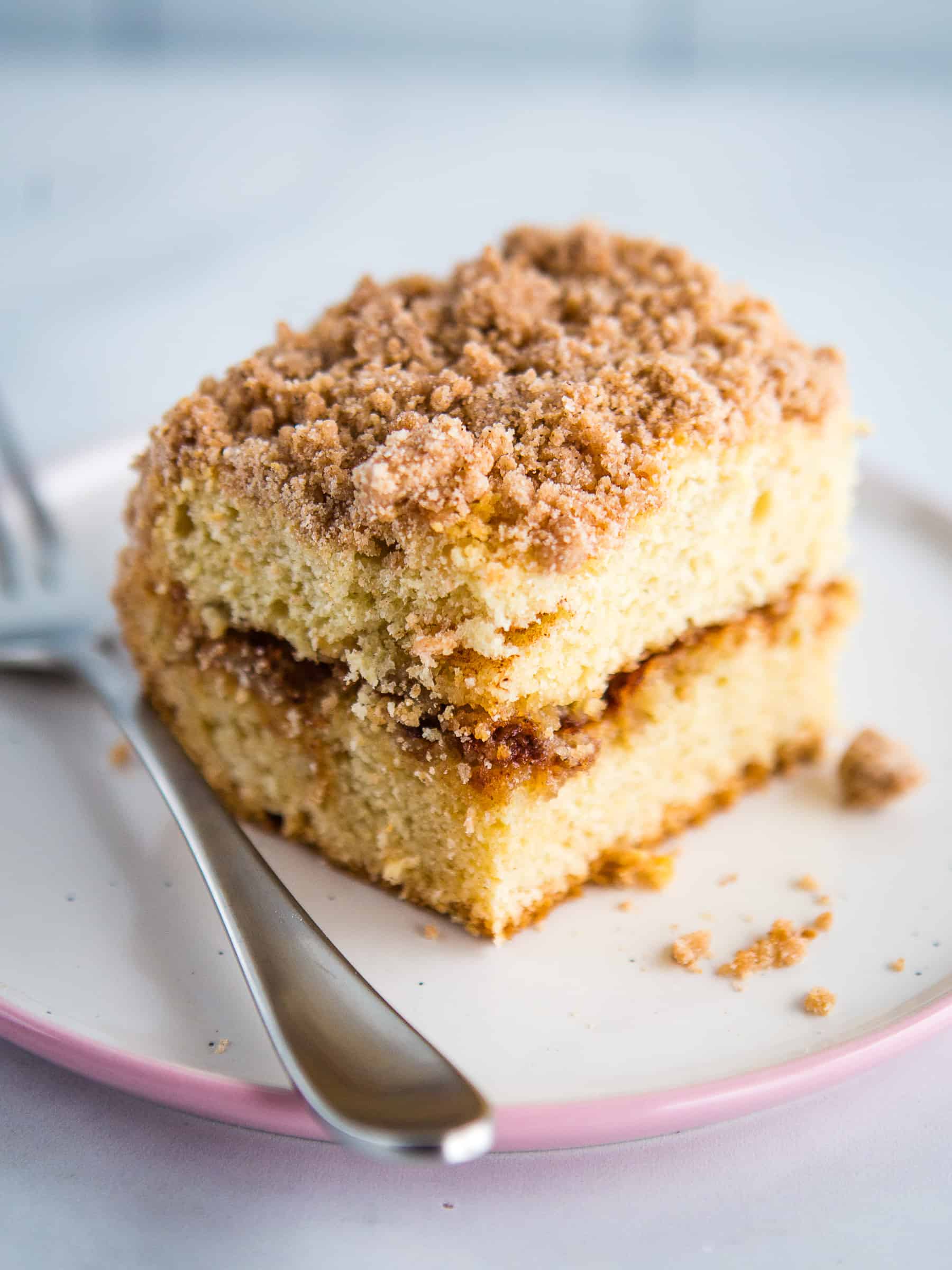 A slice of gluten-free coffee cake on a plate.