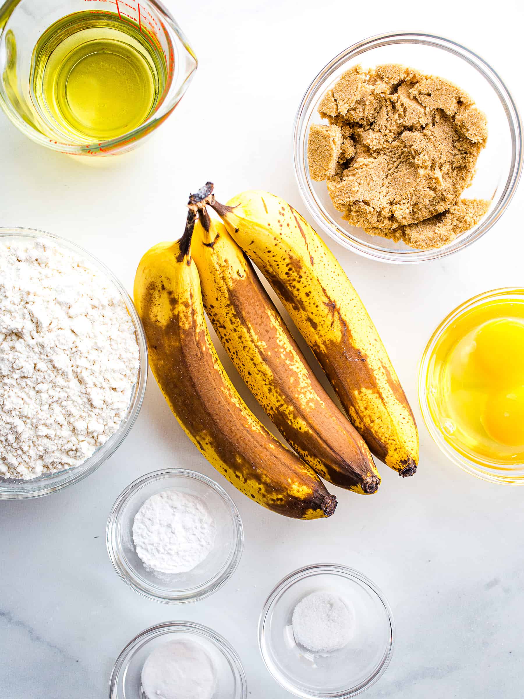 Ingredients for gluten-free banana muffins on the counter.