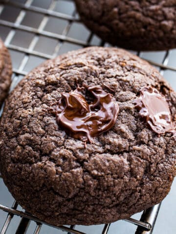 Gluten-Free Chocolate Cookie with warm chocolate chips on top.