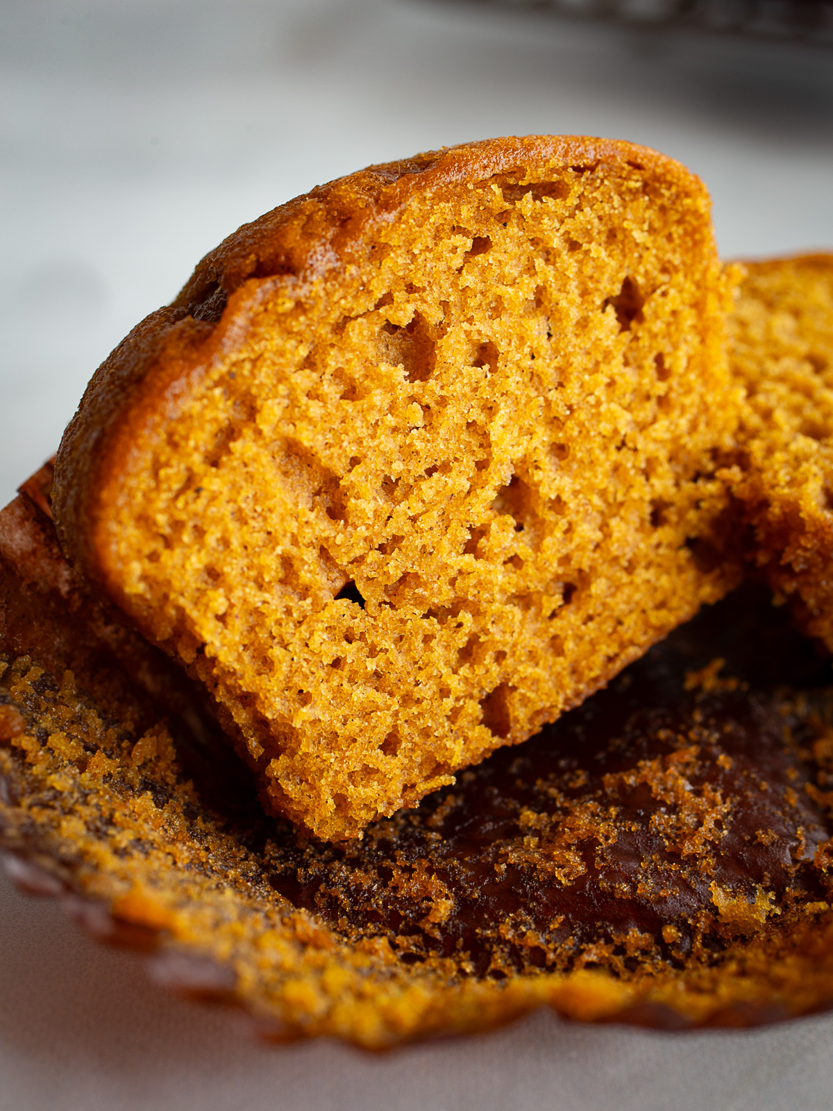 Gluten-free pumpkin muffin split in half.