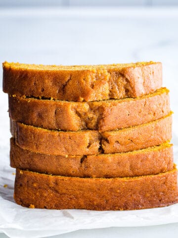 Slices of gluten-free pumpkin bread in a stack.