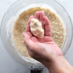 Squeezing gluten-free pie dough to test the consistency. It holds a shape which means it contains enough water.