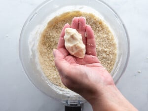 Squeezing gluten-free pie dough to test the consistency. It holds a shape which means it contains enough water.