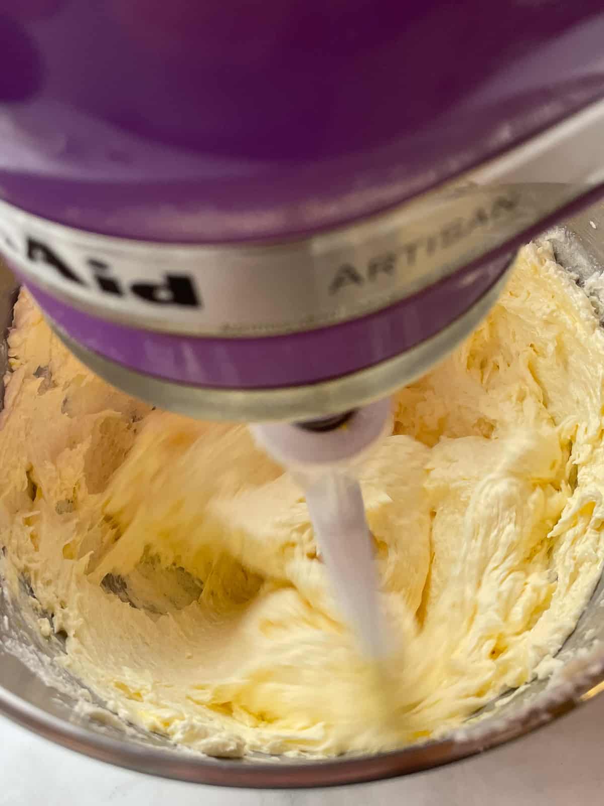 Mixing butter, sugar, and eggs for a gluten-free pound cake.