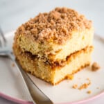 Gluten-free coffee cake slice on a plate with a fork.