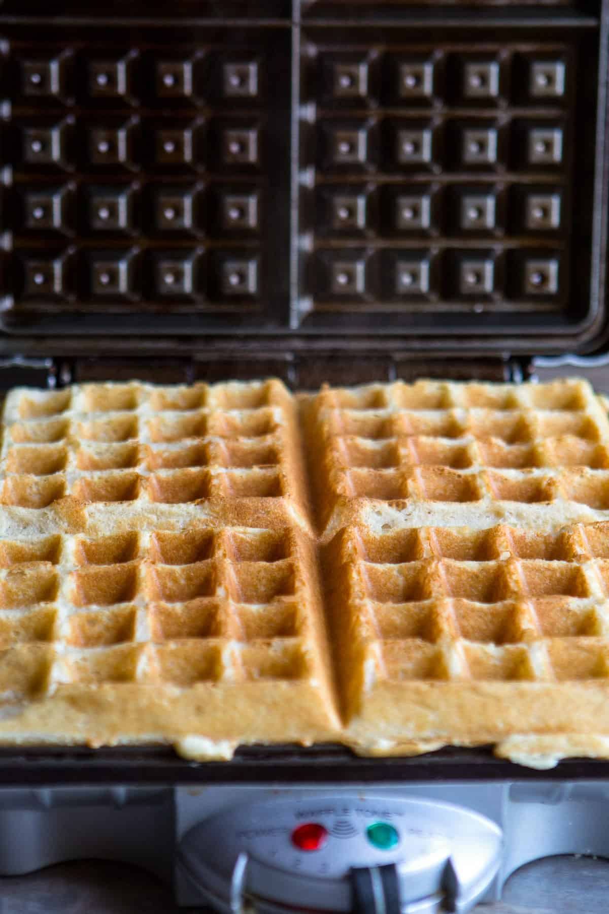 Almond flour waffles in a waffle iron.