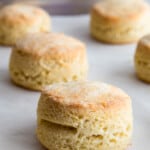 Baked gluten-free biscuits on a baking sheet.