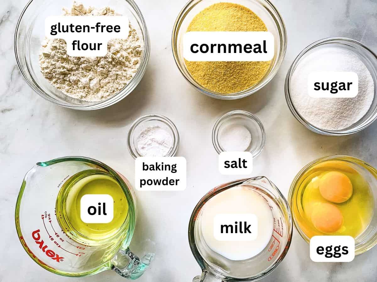 Ingredients for gluten-free corn muffins in individual bowls on the counter.