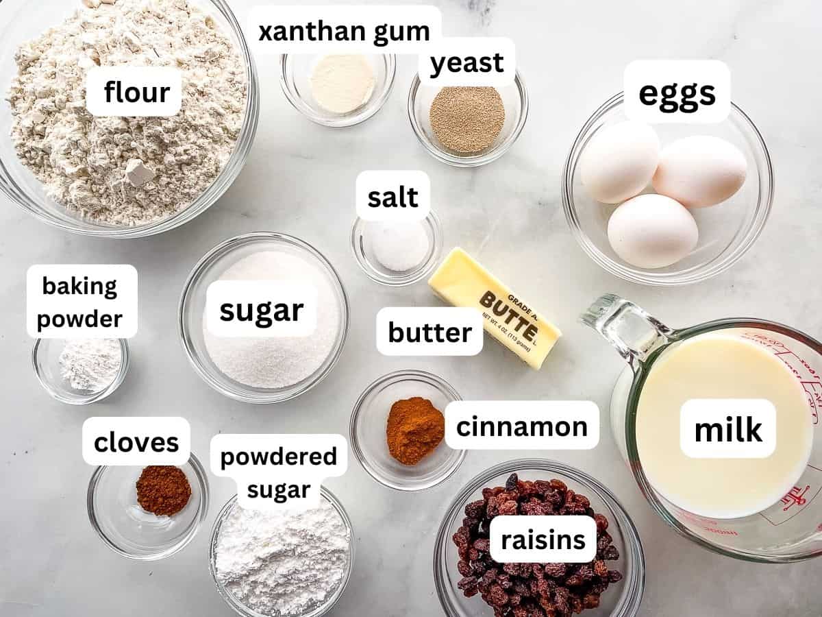 Gluten-free hot cross bun ingredients on the counter in individual bowls.