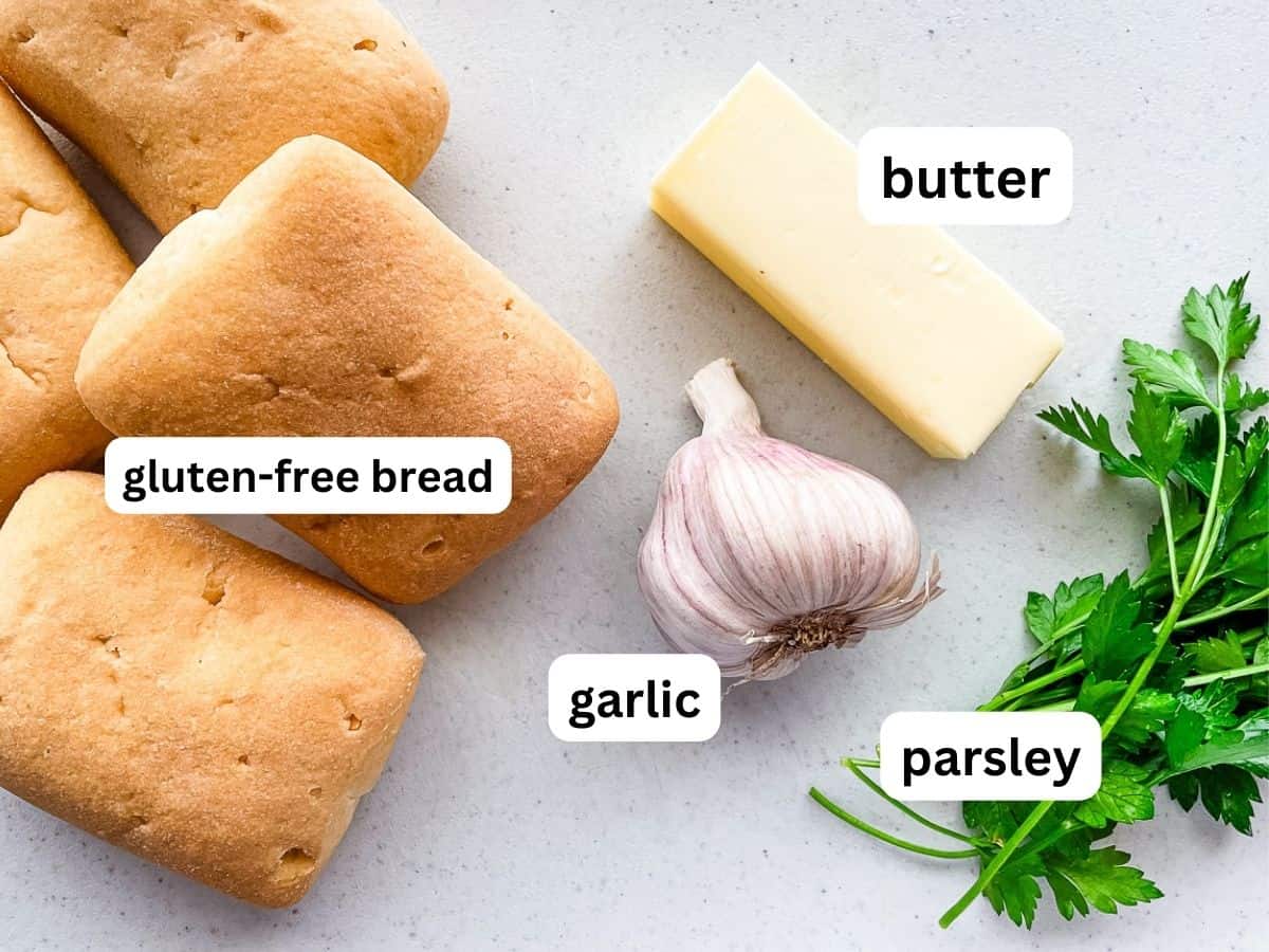Ingredients for gluten-free garlic bread on the counter.